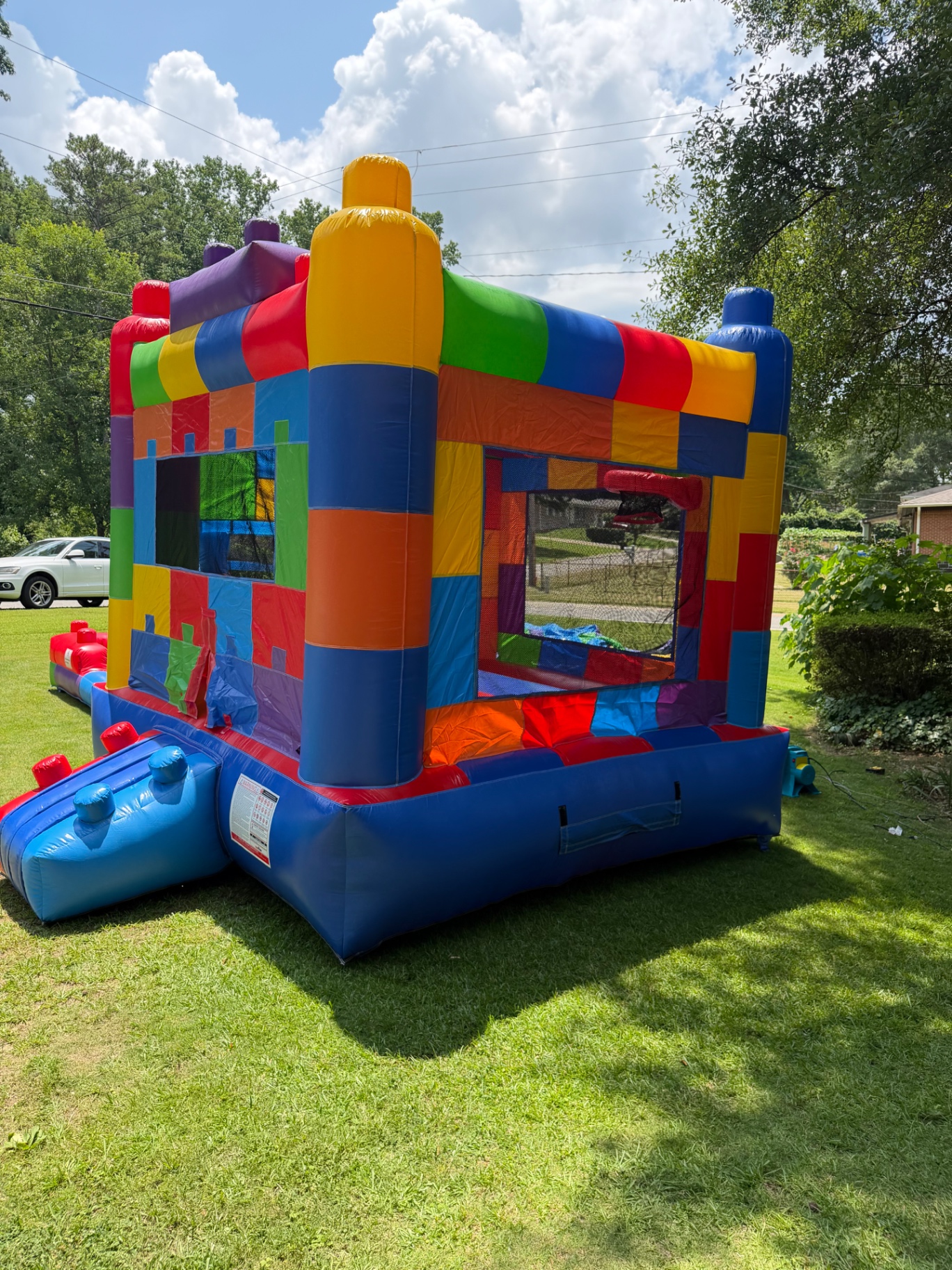 Colorful block-themed bounce house set up on a Georgia lawn
